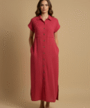 Woman wearing a red raspberry cotton double gauze button-down dress styled for fall fashion, featuring short sleeves, pockets, and a minimal chic look.
